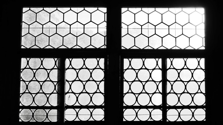 Circular glass windowpanes are a signature feature of the house.